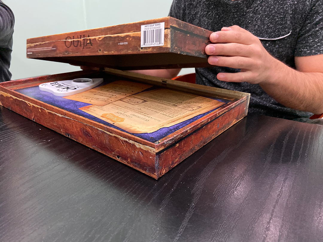 Ouija boards come in different shapes and sizes but all display the alphabet, the numbers 0-9, and short phrases like “yes,” “no,” and “goodbye.” People in the circle place both their index fingers on the planchette, a small teardrop or heart-shaped object, which moves in response to the questions asked to the spirits.
